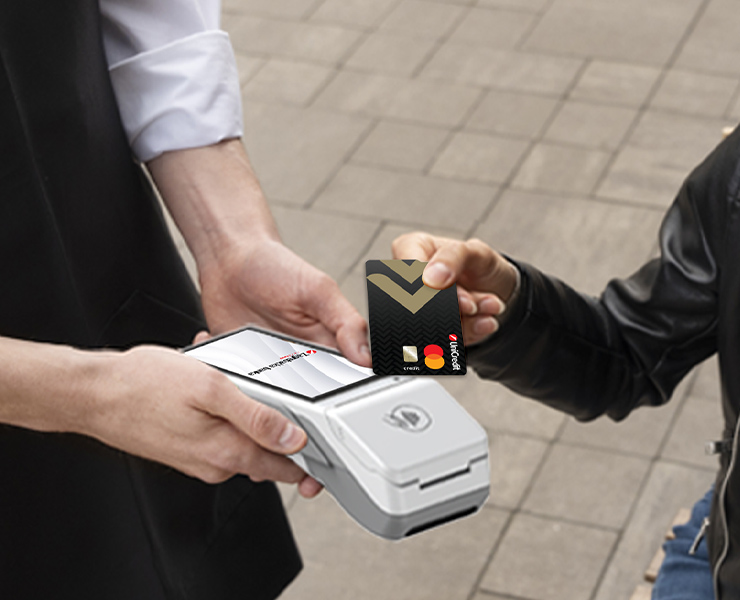 Hand with a card and POS